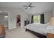 This primary bedroom has neutral paint, dark trim, walk-in closet and lots of natural light at 412 Carr Store Rd, Cedar Grove, NC 27231