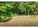 Fenced backyard with trees in the back at 50 Viajar Way, Smithfield, NC 27577