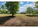 Spacious backyard with partial lawn and distant view of neighboring homes at 50 Viajar Way, Smithfield, NC 27577