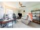 Bedroom featuring a ceiling fan, gaming chair, and a mounted television at 50 Viajar Way, Smithfield, NC 27577