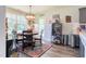 Cozy dining area featuring a stylish light fixture and ample natural light at 50 Viajar Way, Smithfield, NC 27577