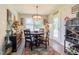 Charming dining area features a round table, unique decor, and access to outdoor space at 50 Viajar Way, Smithfield, NC 27577