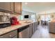 Modern kitchen with granite countertops, stainless steel appliances, and an open layout at 50 Viajar Way, Smithfield, NC 27577
