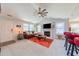 Spacious living room with a fireplace, vaulted ceilings, and carpet flooring; ideal for entertaining at 50 Viajar Way, Smithfield, NC 27577