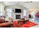 Bright living space features a fireplace, TV, ample windows, and comfortable seating at 50 Viajar Way, Smithfield, NC 27577
