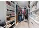Spacious walk-in closet with custom shelves and storage for shoes, clothes and accessories at 50 Viajar Way, Smithfield, NC 27577