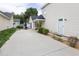 Exterior of home and backyard showcasing a concrete patio and outdoor seating area with a black metal table at 505 Stratton Way, Durham, NC 27704