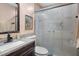 Cozy bathroom featuring granite counters, framed mirror, and shower with decorative glass at 505 Stratton Way, Durham, NC 27704