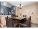 Open dining area featuring a wood table with seating for six and modern chandelier at 505 Stratton Way, Durham, NC 27704