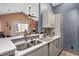 Well-lit kitchen with modern countertops, stainless steel sink, and sleek cabinetry at 505 Stratton Way, Durham, NC 27704