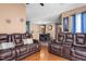 Spacious living room showcasing a dining area, hardwood floors, and leather sofa and loveseat at 505 Stratton Way, Durham, NC 27704