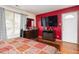 Spacious bedroom featuring hardwood floors, large TV, and ample closet space at 505 Stratton Way, Durham, NC 27704