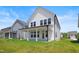 Spacious backyard with a covered patio offering an inviting space for relaxation and entertaining at 5113 Ranger Grove Way, Raleigh, NC 27604