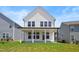 Well-maintained backyard featuring a covered patio and lush green lawn, perfect for outdoor living at 5113 Ranger Grove Way, Raleigh, NC 27604