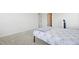 Minimalist bedroom with neutral carpet and light walls provide a relaxing and modern aesthetic at 5113 Ranger Grove Way, Raleigh, NC 27604