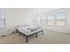 Sunny bedroom featuring a bed, carpet, and natural light from multiple windows at 5113 Ranger Grove Way, Raleigh, NC 27604