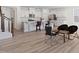 Open concept kitchen featuring a spacious island with barstool seating and modern appliances at 5113 Ranger Grove Way, Raleigh, NC 27604