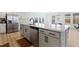 Spacious kitchen featuring an island with storage, stainless steel appliances, and a bright sunny window at 5113 Ranger Grove Way, Raleigh, NC 27604