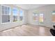 Sunlit living room with large windows and beautiful flooring at 5113 Ranger Grove Way, Raleigh, NC 27604