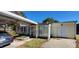 Back exterior featuring a covered carport and a small backyard at 526 N Fairview Rd, Rocky Mount, NC 27801