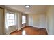 Bedroom with hardwood floors, large windows, neutral color scheme, and closet at 526 N Fairview Rd, Rocky Mount, NC 27801