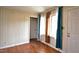 Cozy bedroom featuring hardwood flooring, closet, and bright windows at 526 N Fairview Rd, Rocky Mount, NC 27801
