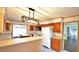 Spacious kitchen featuring wood cabinets, updated lighting, and lots of counter space at 526 N Fairview Rd, Rocky Mount, NC 27801