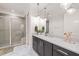 Bathroom featuring marble countertops, a large mirror, modern pendant lighting, and a glass-enclosed shower at 5308 Montclair Dr, Raleigh, NC 27609