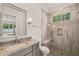 Bathroom featuring a shower with a glass enclosure, stylish tile, and a granite vanity at 5308 Montclair Dr, Raleigh, NC 27609