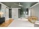 Comfortable Bedroom with olive green walls, hardwood floors, and a minimalist aesthetic at 5308 Montclair Dr, Raleigh, NC 27609