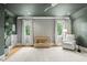 Lovely Bedroom featuring neutral colors, hardwood floors, a crib, and two bright windows at 5308 Montclair Dr, Raleigh, NC 27609
