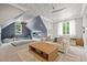 Large bonus room featuring a cloud painted ceiling, multiple seating areas, and great natural light at 5308 Montclair Dr, Raleigh, NC 27609