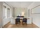 Light-filled dining room with modern lighting and a view to the exterior at 5308 Montclair Dr, Raleigh, NC 27609