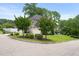 Well-maintained yard with lush landscaping complementing this gray two-story home at 5308 Montclair Dr, Raleigh, NC 27609