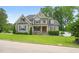 Charming two-story home with a manicured front lawn and inviting curb appeal at 5308 Montclair Dr, Raleigh, NC 27609