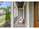 Cozy front porch featuring stone flooring, natural lighting, and comfortable seating at 5308 Montclair Dr, Raleigh, NC 27609