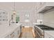Bright kitchen with stainless steel appliances and large island with quartz countertops at 5308 Montclair Dr, Raleigh, NC 27609