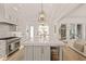 Bright kitchen with a large island, stainless steel appliances, and an open layout at 5308 Montclair Dr, Raleigh, NC 27609