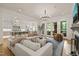 Open concept living room and kitchen with hardwood floors and bright white decor at 5308 Montclair Dr, Raleigh, NC 27609