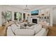 Bright living room featuring a fireplace, large sectional sofa, and sliding glass doors at 5308 Montclair Dr, Raleigh, NC 27609