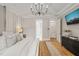 Airy main bedroom featuring hardwood floors, elegant decor, and access to an ensuite bathroom at 5308 Montclair Dr, Raleigh, NC 27609