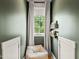 Cozy reading nook with a comfortable beanbag chair, a bright window, and convenient bookshelves at 5308 Montclair Dr, Raleigh, NC 27609