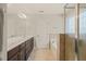 A bright bathroom offers double sink vanity, large mirror, and separate glass shower and bathtub at 5412 Emerald Spring Dr, Knightdale, NC 27545