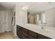 A spacious bathroom has a double sink vanity, a large mirror, and a glass-enclosed shower and tub at 5412 Emerald Spring Dr, Knightdale, NC 27545