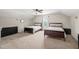Large bedroom with carpeted floor, 2 twin beds, window, and dark wood furniture at 5412 Emerald Spring Dr, Knightdale, NC 27545