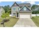 Beautiful two-story home with well-kept lawn, mature trees, and attached two-car garage at 5412 Emerald Spring Dr, Knightdale, NC 27545