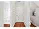 Hallway featuring a powder room, mud room, and hardwood floors at 5412 Emerald Spring Dr, Knightdale, NC 27545