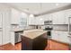 Bright kitchen featuring stainless appliances, gray backsplash, and granite countertops at 5412 Emerald Spring Dr, Knightdale, NC 27545
