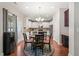 Open eat-in kitchen featuring stainless appliances, white cabinets, and a round breakfast table at 5412 Emerald Spring Dr, Knightdale, NC 27545