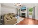 Bright living room with hardwood floors, fireplace, ceiling fan, and comfortable seating at 5412 Emerald Spring Dr, Knightdale, NC 27545